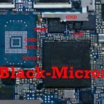 An image of a black micron chip on a motherboard.