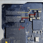 A close up of a micro sd card on a motherboard.