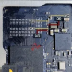 A close up of a micro sd card on a motherboard.